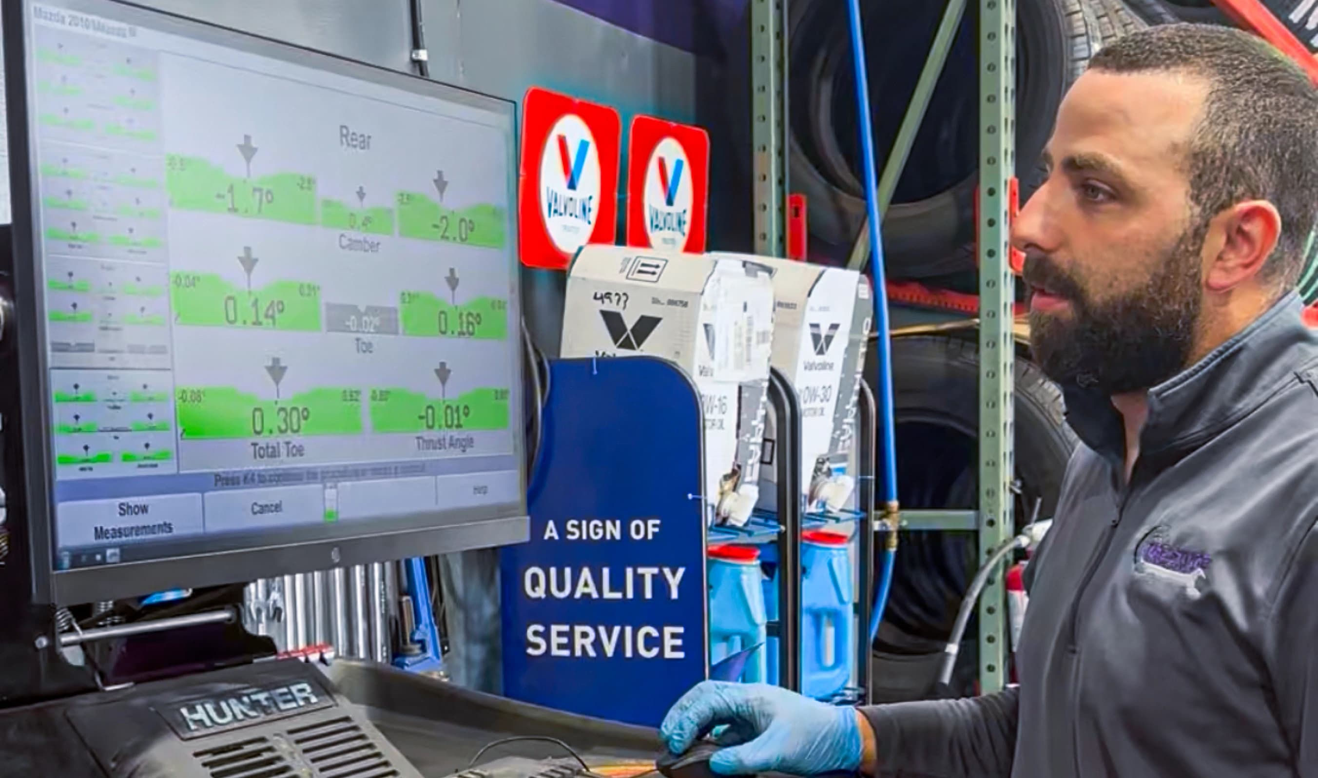 Modern alignment machine display showing measurements