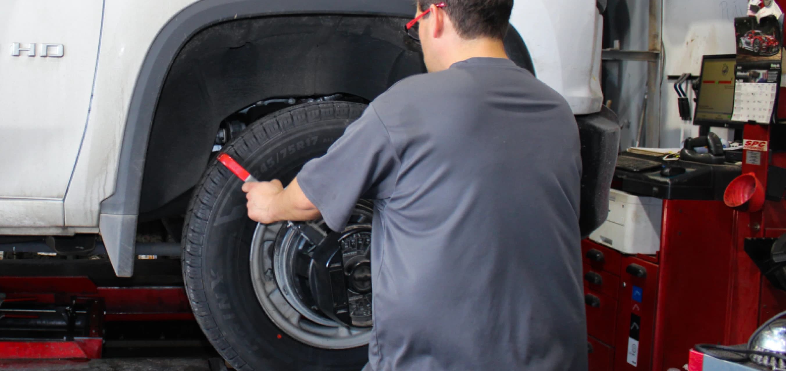 Close-up of alignment equipment attached to wheel