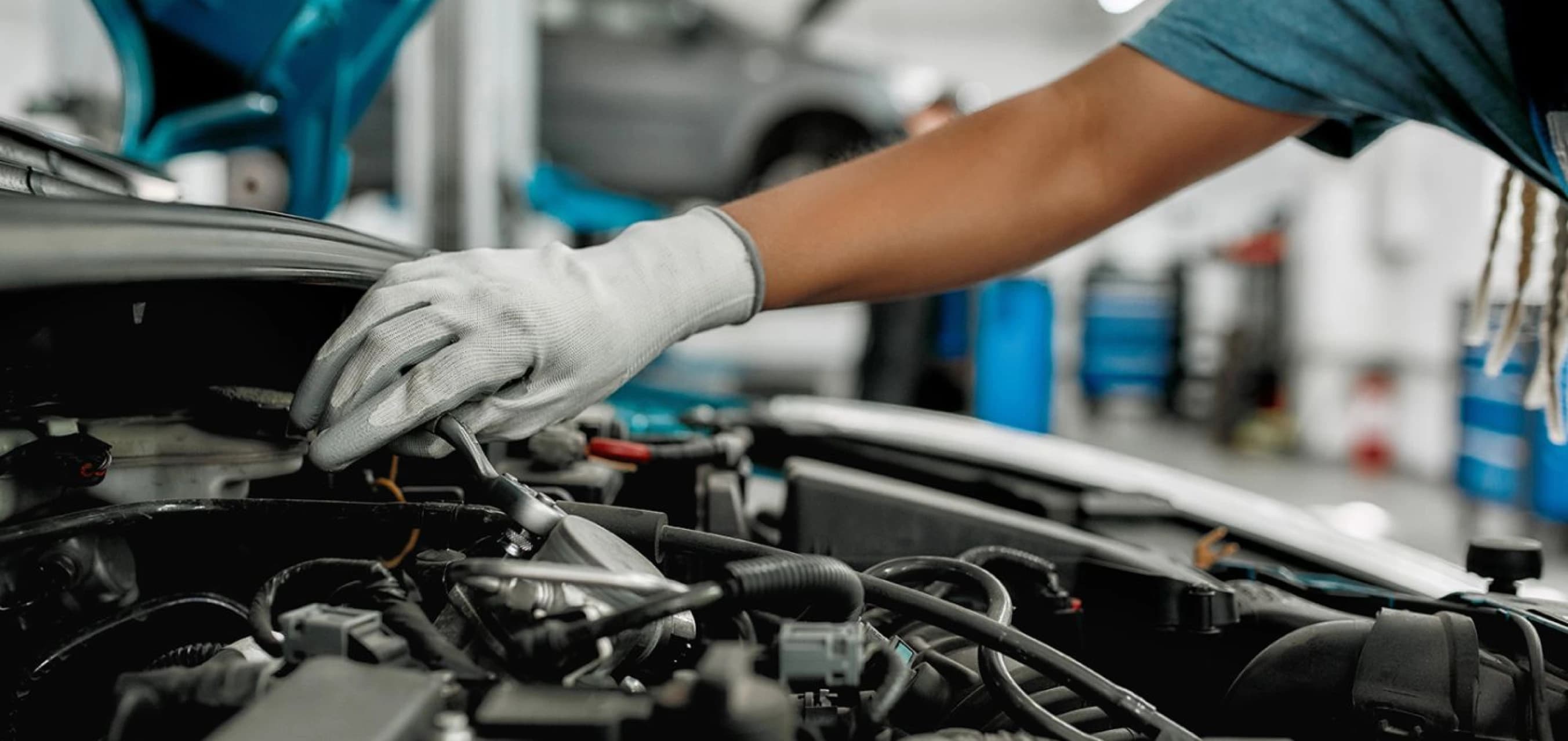 Mechanic pointing at a car