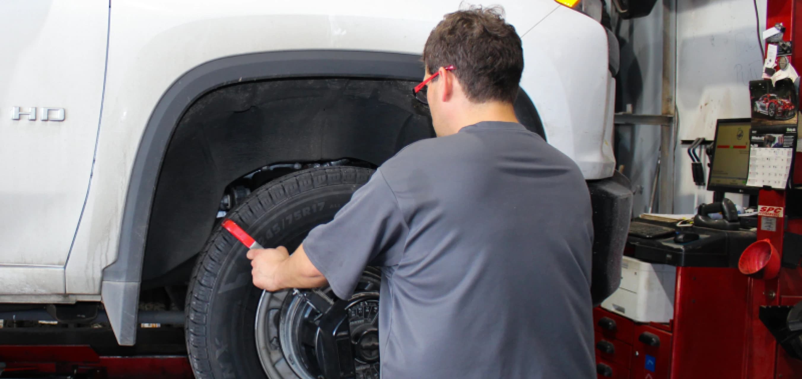 Mechanic checking tire balance