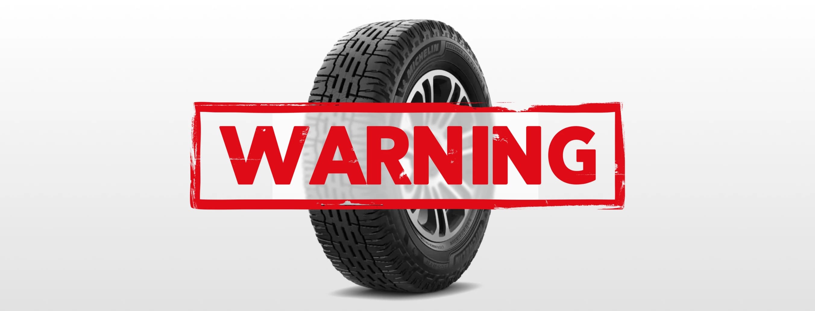 Warning symbol over regular tire